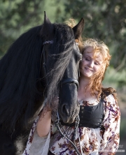 Woman with black Friesian Stallion in Ojai, CA