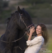 Ojai, CA, purebred horse, woman and Friesian stallion
