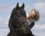 purebred Friesian gelding with owner in Castle Rock, CO