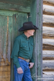 Flitner Ranch, Shell, WY - older cowboy leaning against door frame
