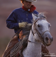 Flitner Ranch, Shell, WY - Cowboy riding grey gelding fast