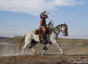 Flitner Ranch, Shell, WY - cowboy riding coiling rope