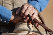 Flitner Ranch, Shell, WY - cowboy's hands on the reins