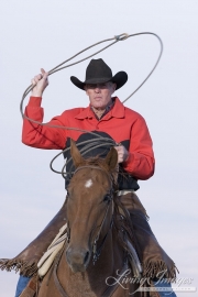 Flitner Ranch, Shell, WY - older cowboy running swinging rope