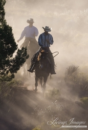 Two cowboys ride in dust , San Cristobal Ranch, NM