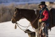 Flitner Ranch, Shell, WY, horses in winter, cowboy and dog in the snow