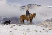 Flitner Ranch, Shell, WY, horses in winter, cowboy on horse with border collie