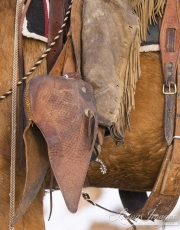 Flitner Ranch, Shell, WY, horses in winter, detail of cowboy's stirrup and chaps