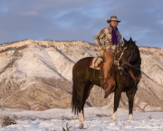 Flitner Ranch, Shell, WY, horses in winter, cowboy siting on horse in snow